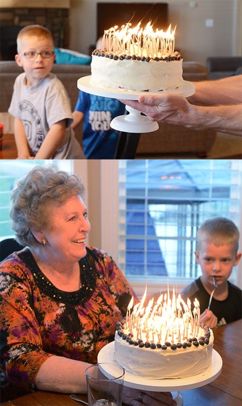 Lemon Blueberry Cake with all of the candles lit being given to our neighbor Carol.