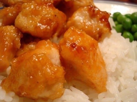 Honey glazed chicken over white rice.