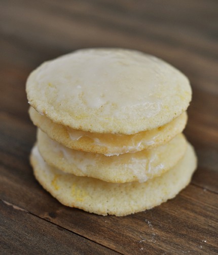 A stack of four light yellow buttermilk cookies on a countertop.