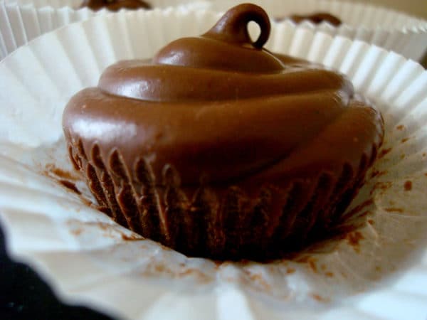Chocolate peanut butter cup on a white muffin liner.