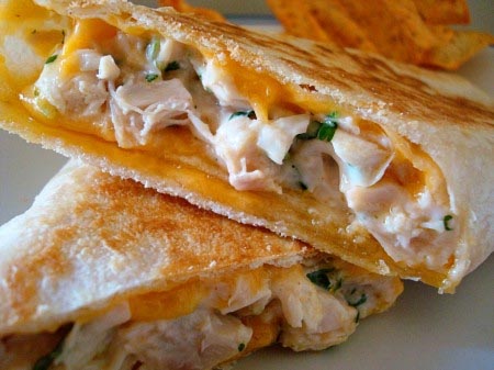 Chicken and cheese wrap cut in half.