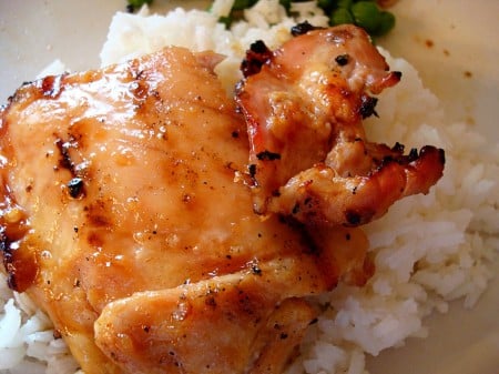 grilled chicken on a bed of white rice