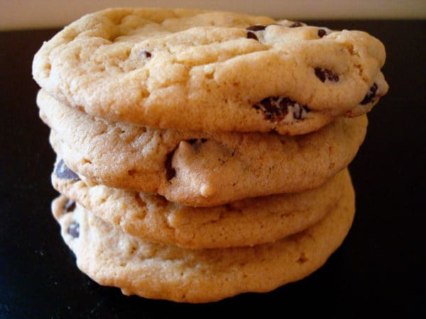 Four chocolate chip cookies stacked.