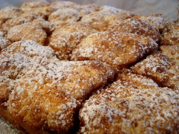 Pan of sugar dusted sweet buns.