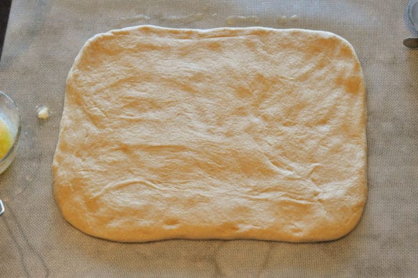 bread dough rolled in a large rectangle