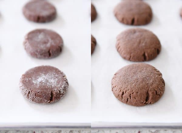 pressed and baked chocolate peanut butter stuffed cookies on parchment paper