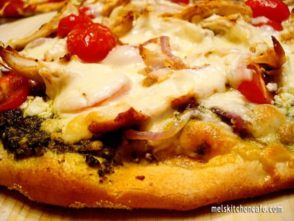 Side view of a pesto pizza.