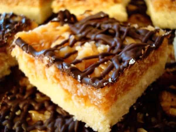 Samoa bar with chocolate drizzle on top.