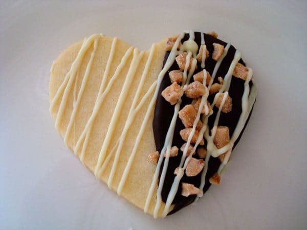 heart shaped sugar cookie drizzled with white chocolate