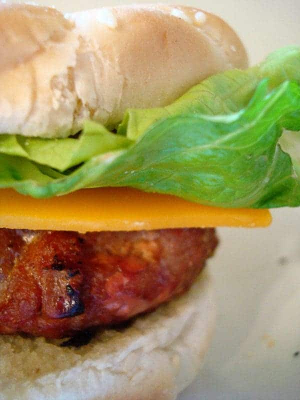 Burger with lettuce and cheese.