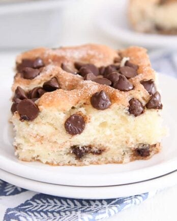 square slice of chocolate chip cake on white plate