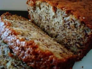 A loaf of banana bread with a few slices cut off.