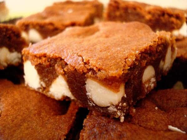 Chocolate gingerbread squares with white chocolate chunks.