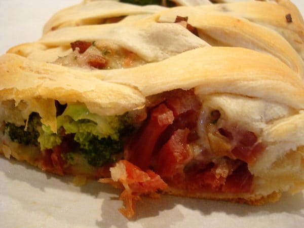Bread filled with cheese ham and broccoli.
