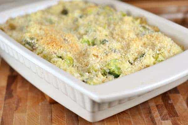 Broccoli and rice casserole in a white dish.