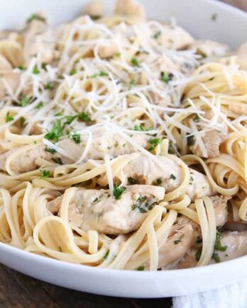 lemon chicken pasta with Parmesan in white dish