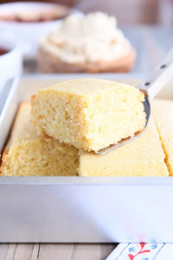 Piece of cornbread out of pan on spatula.