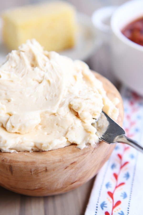 Fluffy honey butter in a wood bowl.