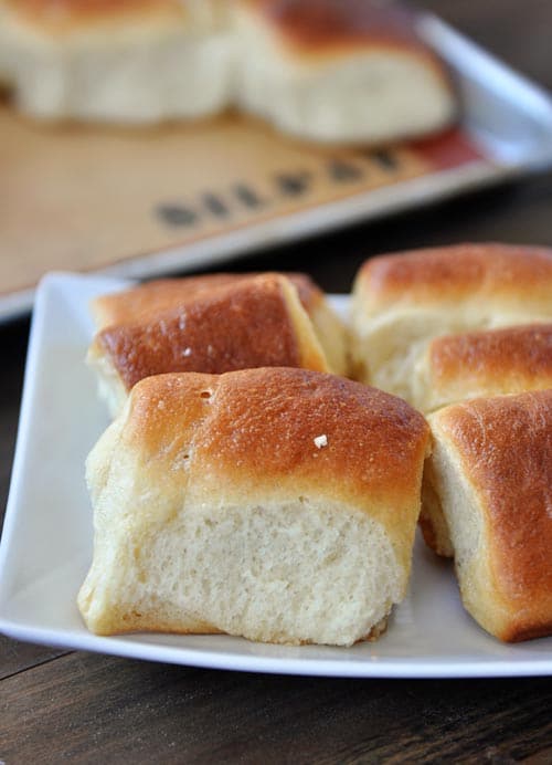 parker house rolls on a white plate