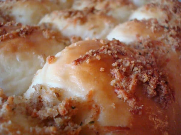 close up of a pan of parmesan and herb crusted rolls