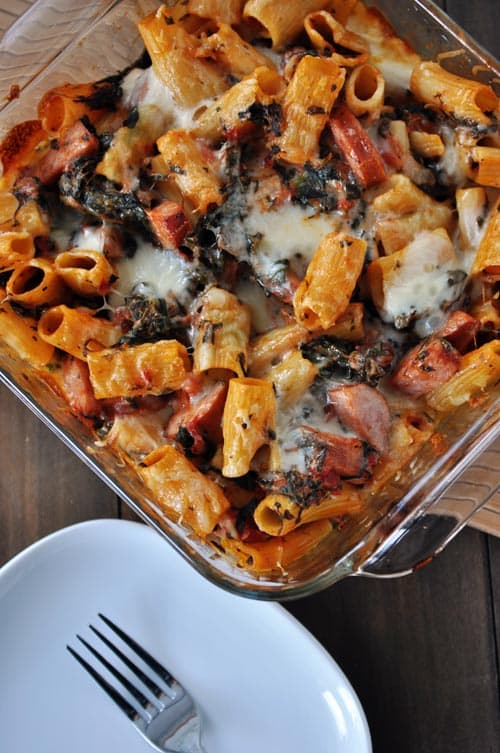 Casserole dish with baked pasta, cheese and chicken sausage.