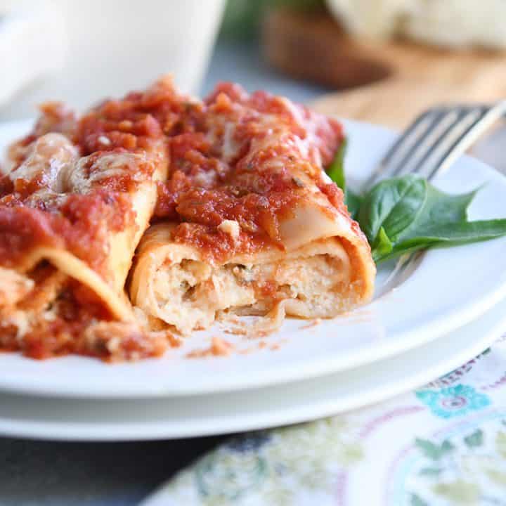 baked manicotti on white plate