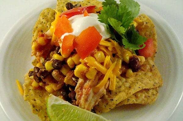 Slow Cooker Southwest Chicken Stacks with tortilla chips and toppings