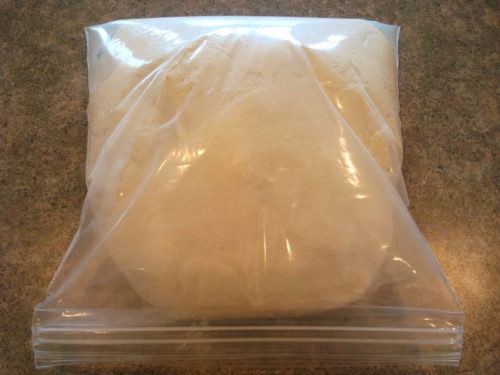 risen bread dough in a Ziploc bag