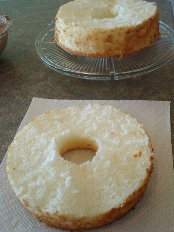 the top layer cut off of an angel food cake