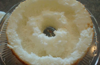 cut open angel food cake with a tunnel inside