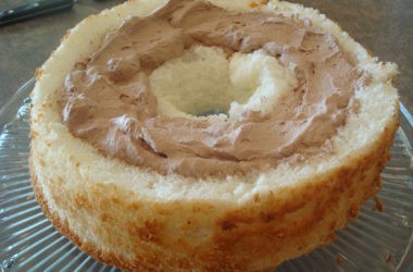 angel food cake with chocolate frosting in the middle