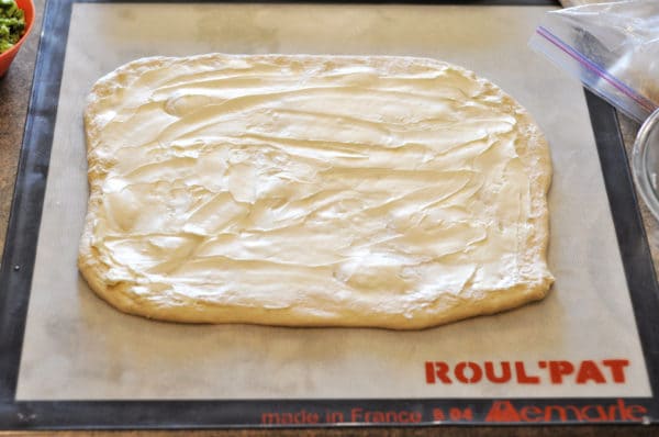 dough rolled out in a rectangle and brushed with butter