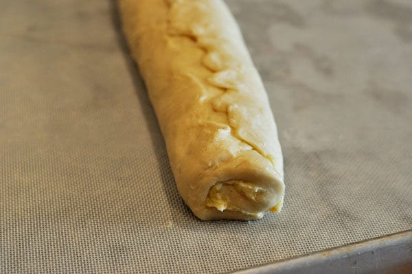 Bread dough rolled into a log.