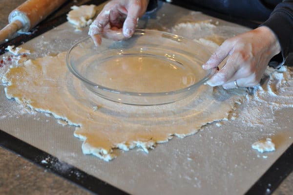 rolled out pie crust with a pie dish over the top
