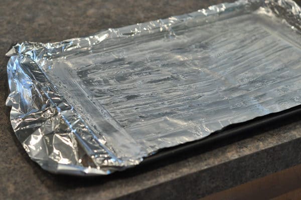 buttered and tinfoil lined cookie sheet