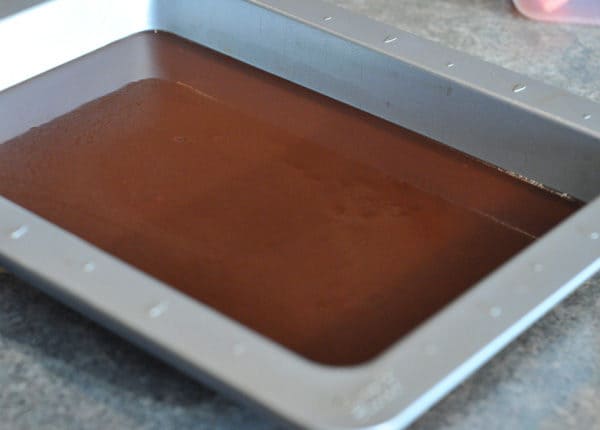 chocolate caramel mixture poured into a 9x13 pan