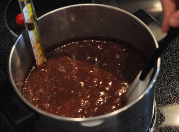 chocolate caramel mixture starting to come to a rapid boil in a large pot
