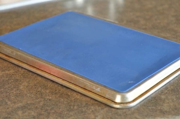 Cookie sheet turned upside down on a counter.