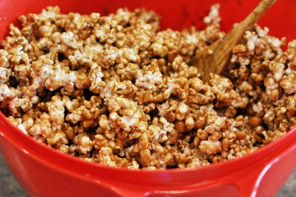 red bowl full of toffee coated popcorn