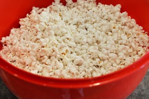 popped popcorn in a red bowl