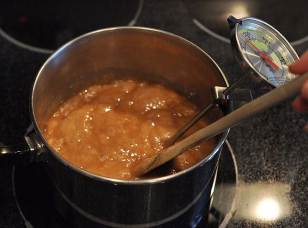 golden brown caramel mixture bubbling in a saucepan