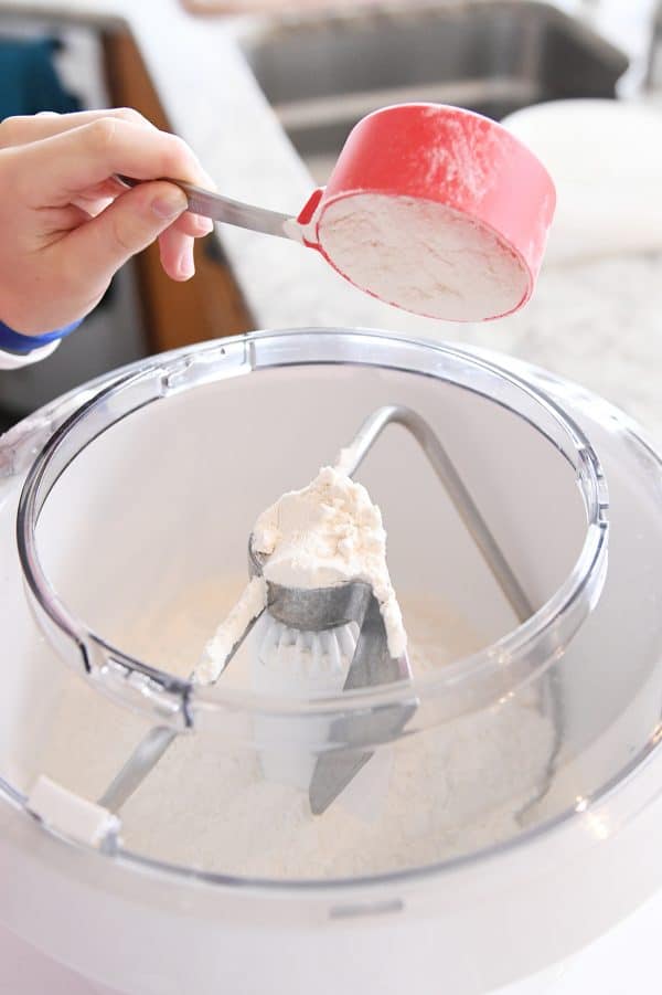 Adding flour to bosch mixer for pretzel dough.