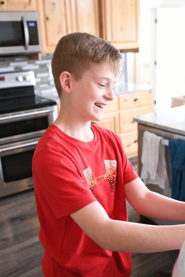 12-year old helping make pretzel bites.