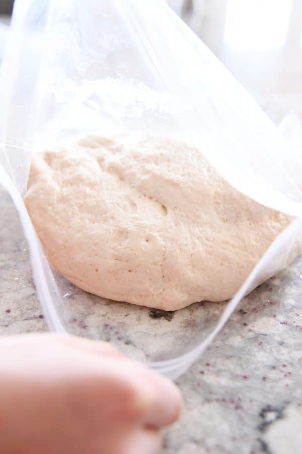 Risen pretzel bite dough in ziploc bag.
