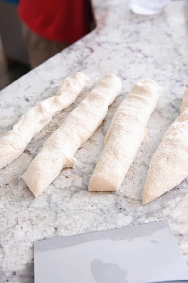 Pretzel dough cut into strips.