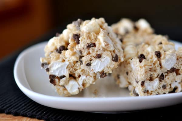 A white plate with marshmallow and chocolate chip studded rice krispies.