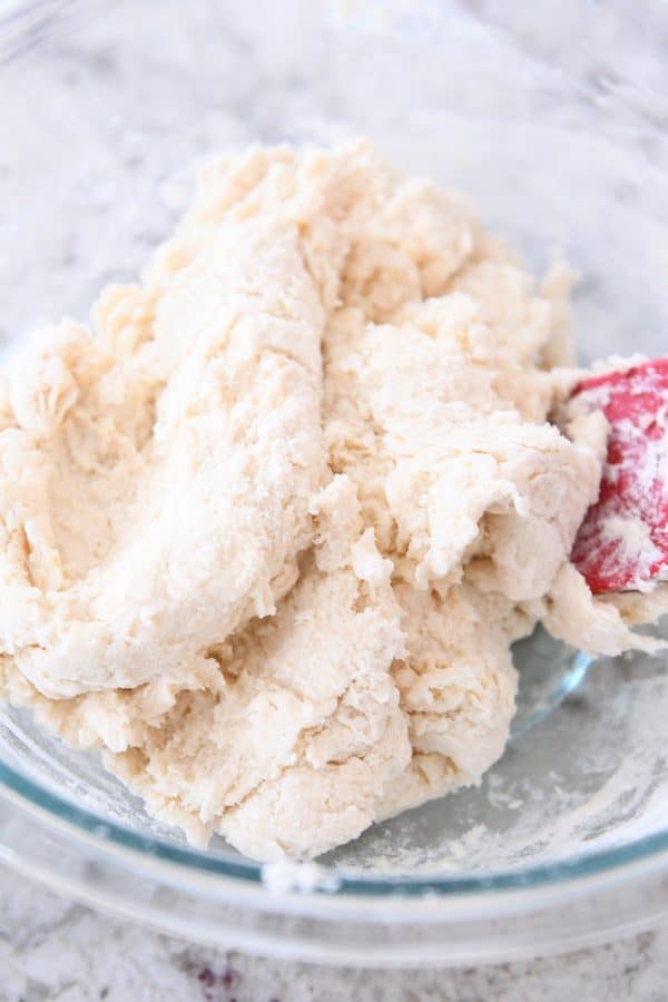 Mixing dough for easy flaky buttermilk drop biscuits.