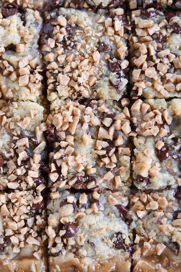 Pan of chocolate chip toffee bars cut into squares.