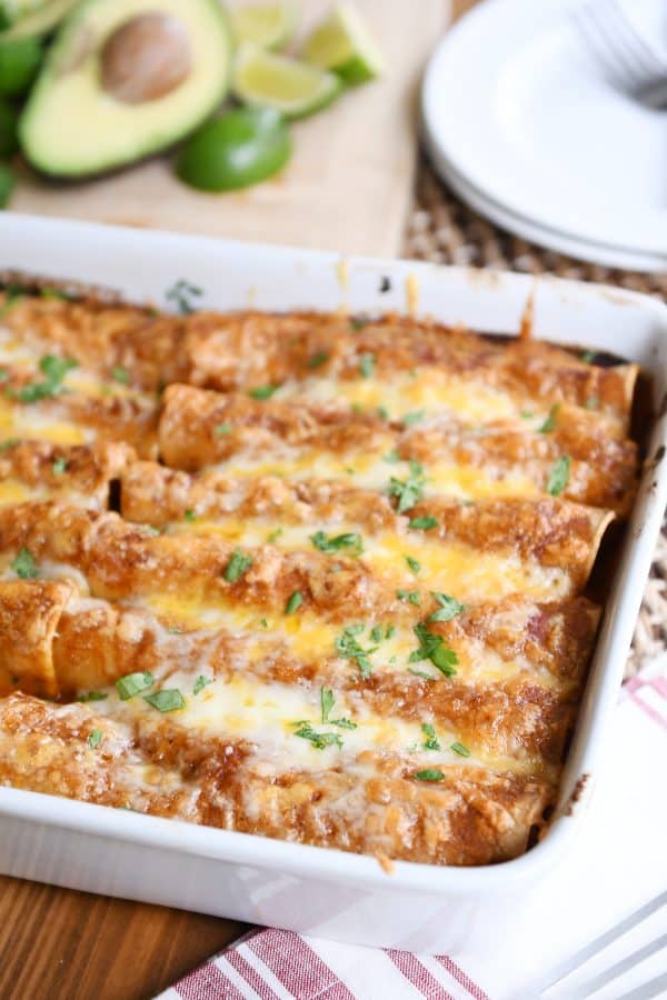 Baked pan of the best red sauce chicken enchiladas.