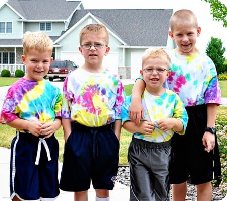 picture of four little boys in tie-dye shirts